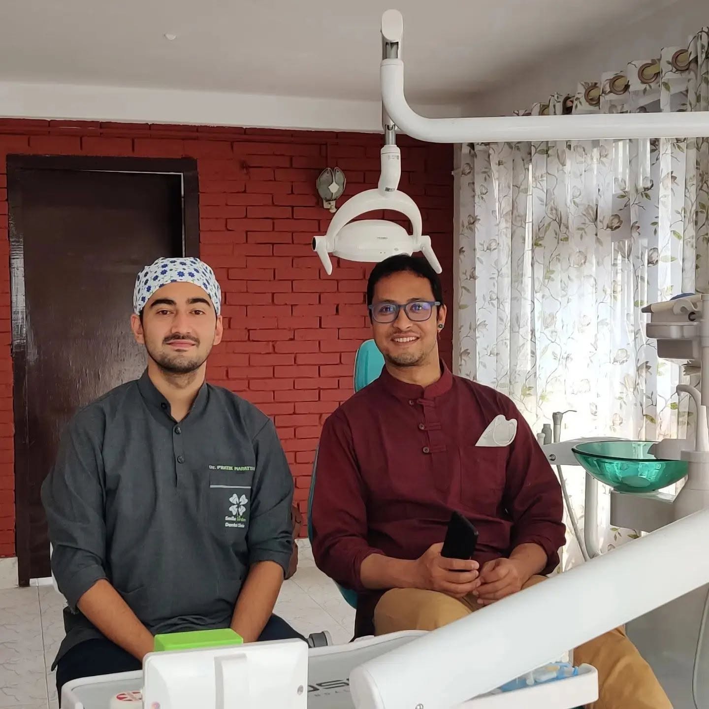 Dr. Pratik with a patient in the clinic